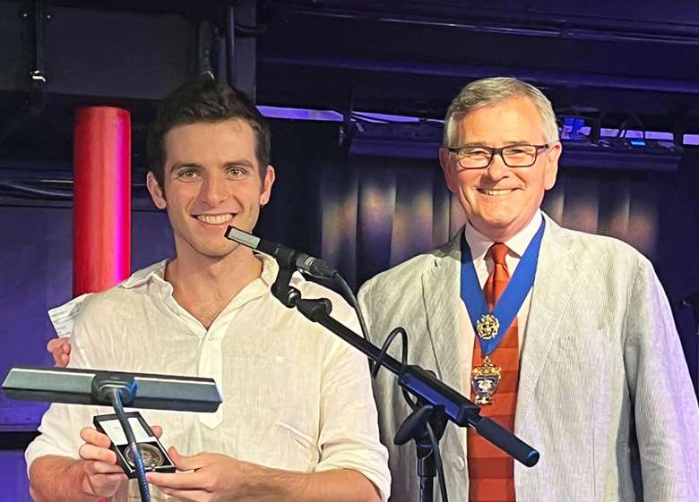 Winner Emile Hinton (left) with Master of The Musicians Company, Jeff Kelly (right)